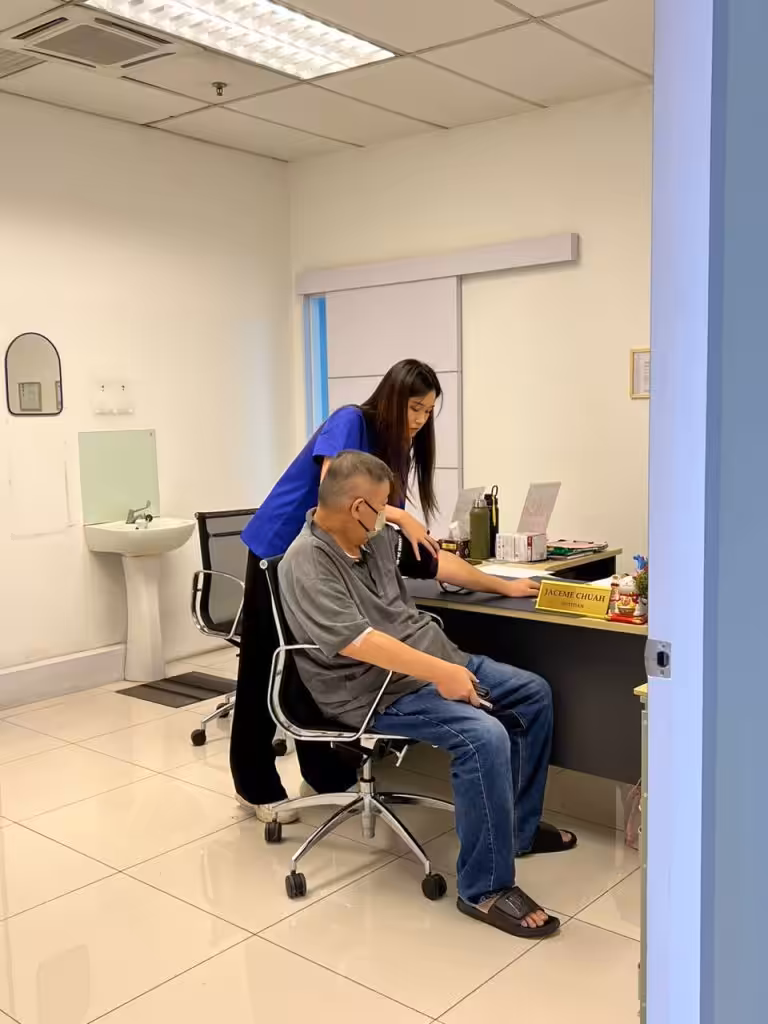 Dietitian reviewing a patient's cardiovascular results at the screening event
